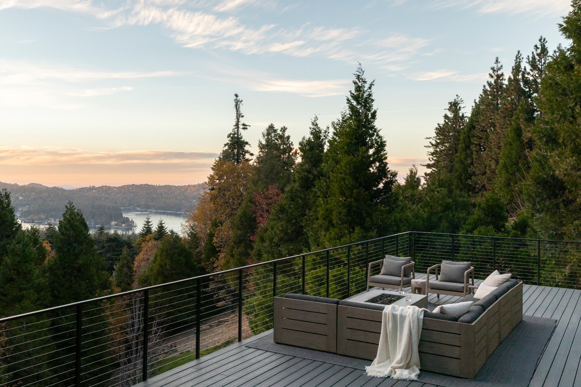 Upper deck at dusk overlooking Lake Arrowhead and the forest