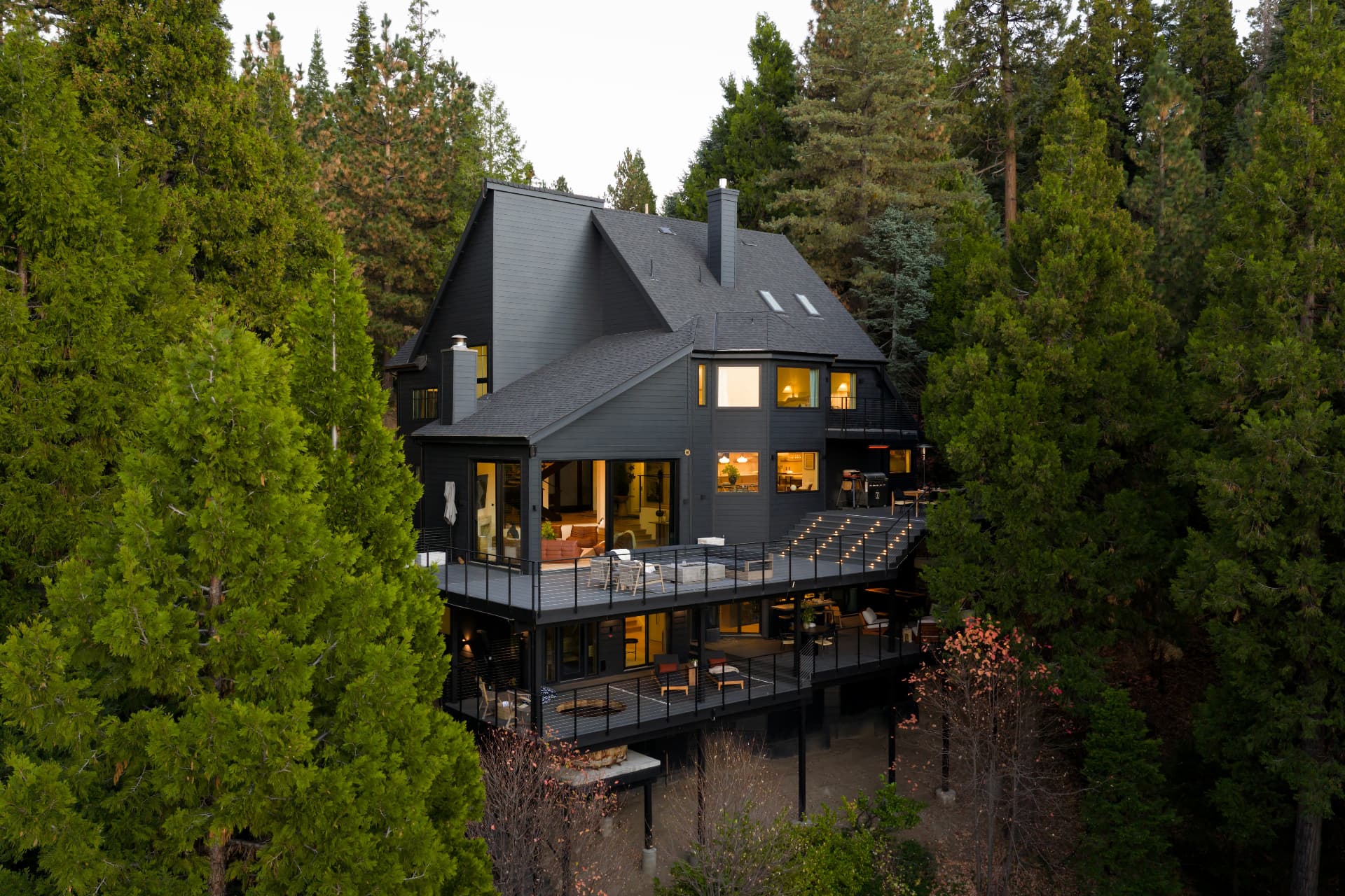 Cumberland's exterior and terraces nestled among tall trees